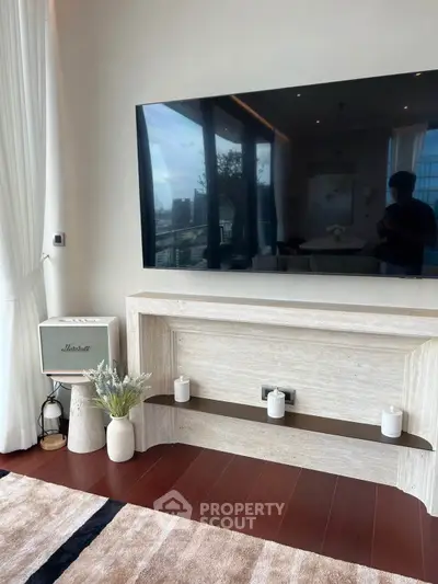 Luxurious living room with modern TV setup and elegant decor