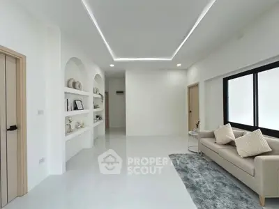 Modern living room with sleek design and cozy seating area