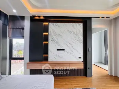 Luxurious modern bedroom with elegant marble accent wall and ambient lighting