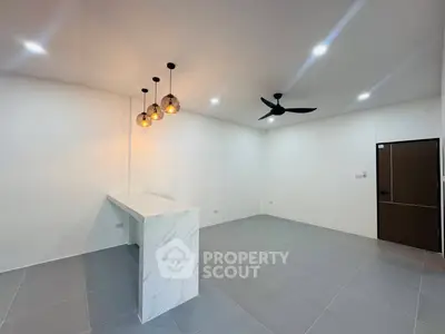 Modern minimalist living room with marble counter and stylish lighting