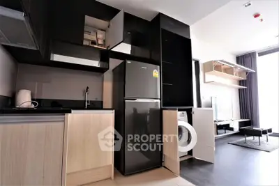 Modern kitchen with sleek appliances and open layout in stylish apartment