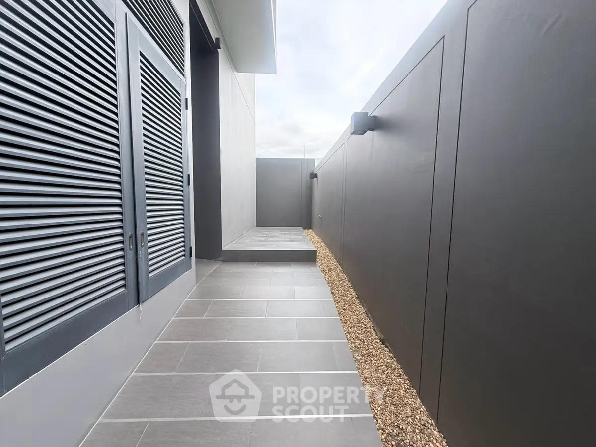 Modern exterior walkway with sleek gray tiles and minimalist design