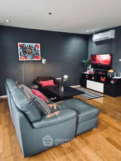 Stylish modern living room with leather sofa and wall art