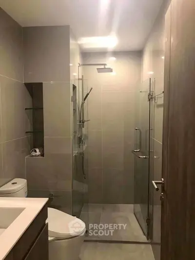Modern bathroom with sleek glass shower and contemporary fixtures