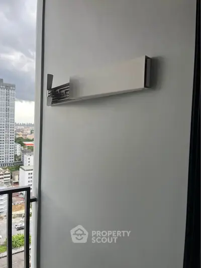 Modern balcony with city view in high-rise apartment