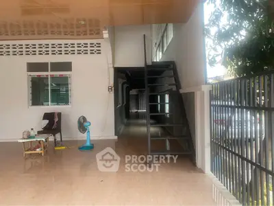 Spacious modern entrance with sleek staircase and polished flooring