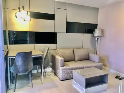 Modern living room with stylish furniture and contemporary lighting in a chic apartment.