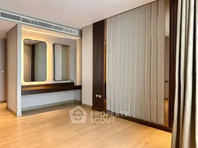 Elegant modern interior with wood flooring and stylish wall paneling, perfect for a sophisticated living space.