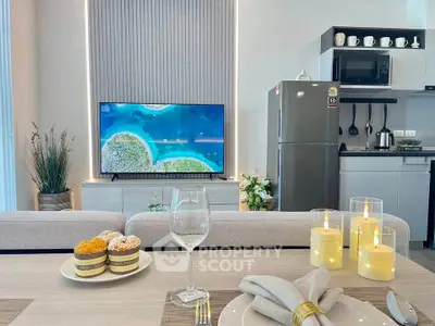 Modern living room with elegant dining setup and sleek kitchen appliances