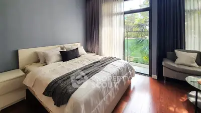 Luxurious bedroom with large window and elegant decor