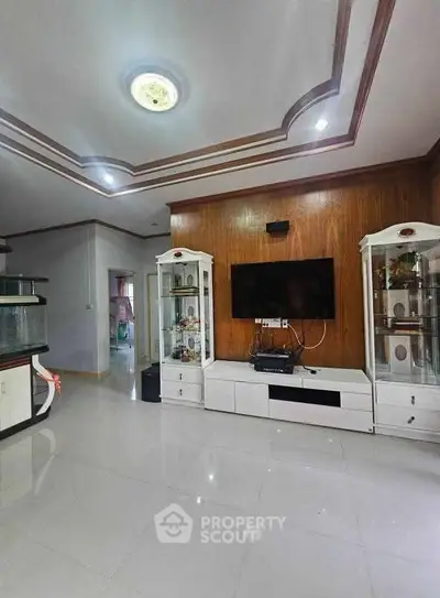 Spacious living room with modern decor and built-in entertainment center