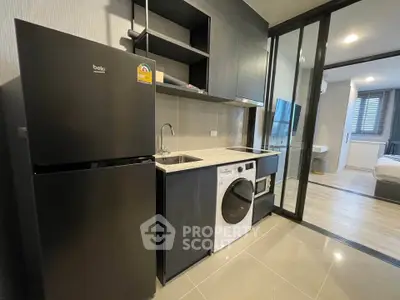Modern compact kitchen with sleek appliances and open layout in stylish apartment