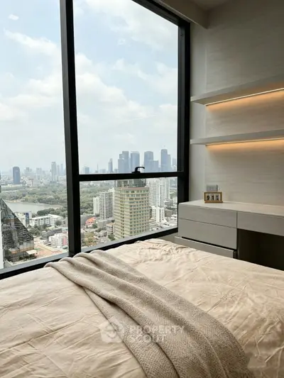 Luxurious bedroom with stunning city view and modern decor