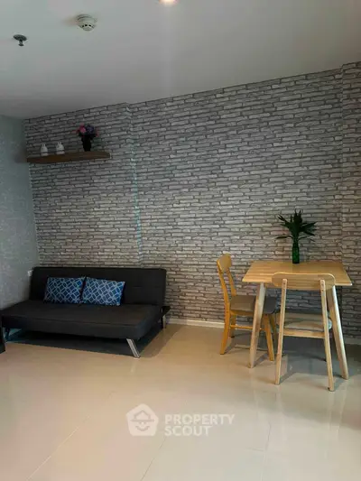 Modern living room with stylish brick wall and cozy furniture