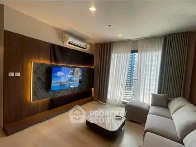 Modern living room with stylish decor and large window offering city view