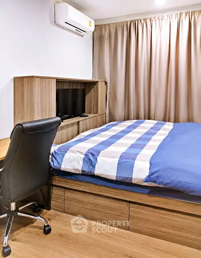 Modern bedroom with stylish wooden furniture and cozy bedding in a well-lit apartment.