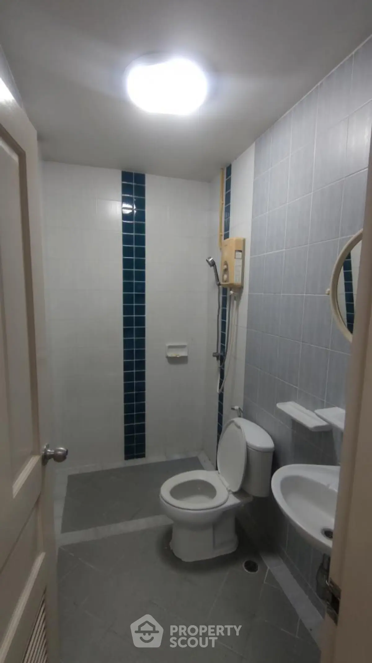 Modern bathroom with sleek design and shower area in a real estate property.