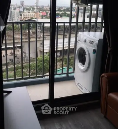 Modern apartment balcony with washing machine and city view