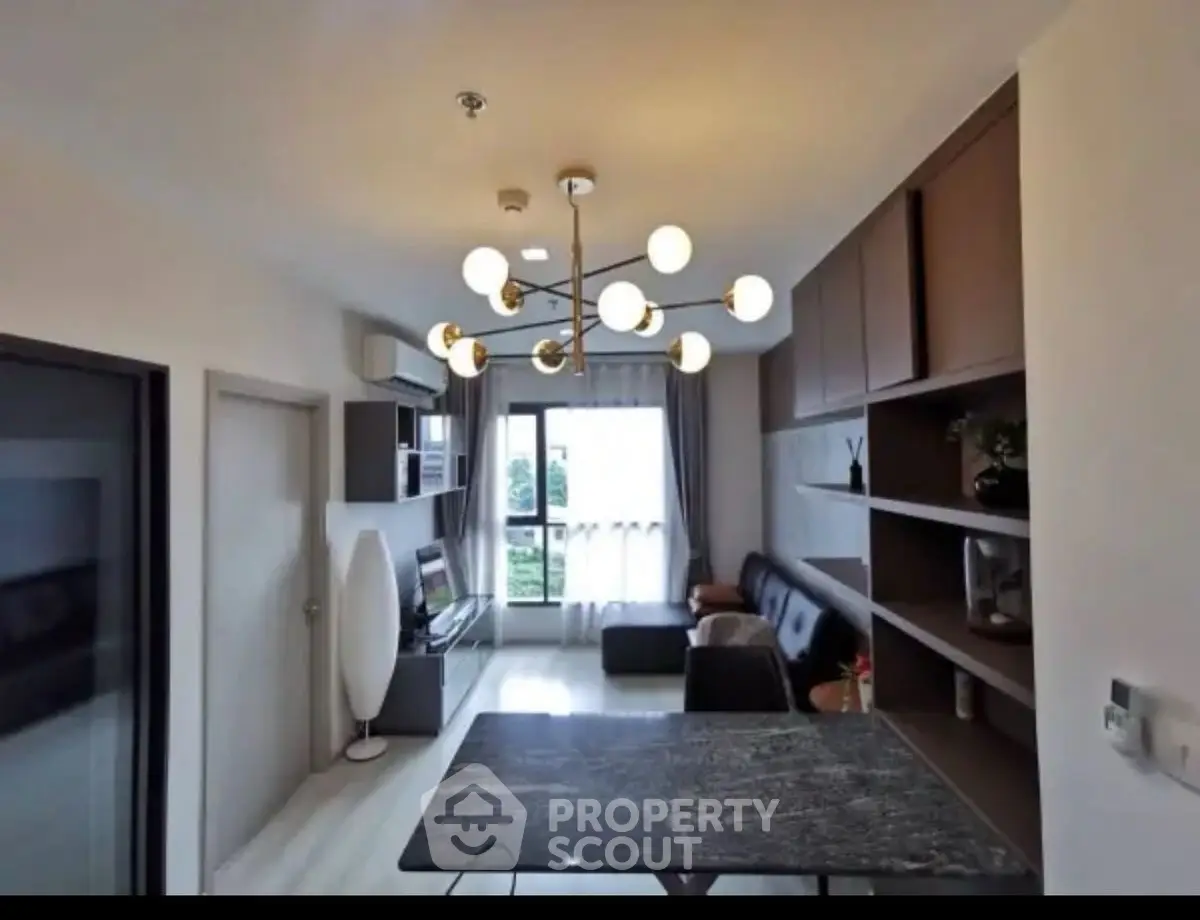 Modern living room with stylish lighting and sleek furniture