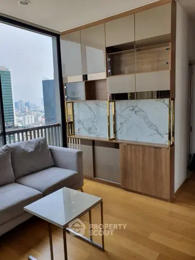 Modern living room with city view, sleek furniture, and wooden flooring.