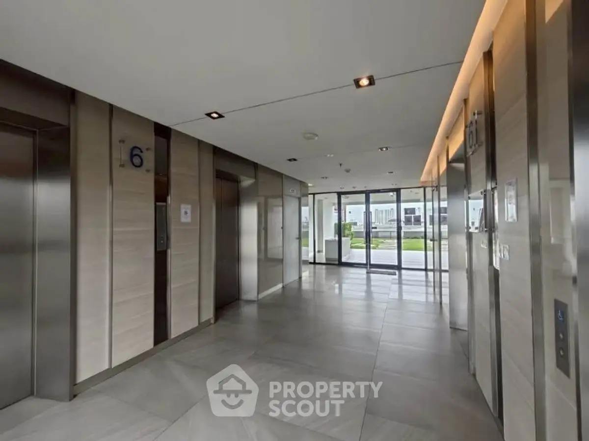 Modern building elevator lobby with sleek design and natural light