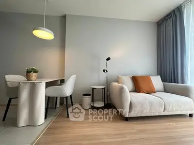 Modern living room with cozy sofa and elegant dining area