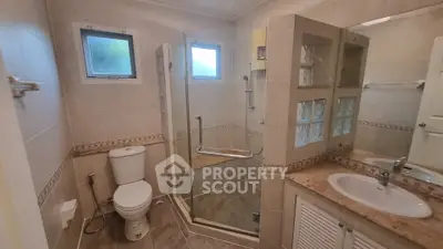 Modern bathroom with glass shower and elegant tile design