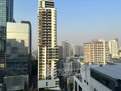 Stunning cityscape view showcasing modern high-rise buildings under a clear blue sky.