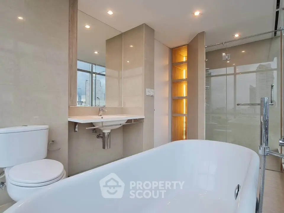 Luxurious modern bathroom with elegant bathtub and city view