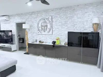 Modern living room with stylish decor and sleek furniture in a contemporary apartment.