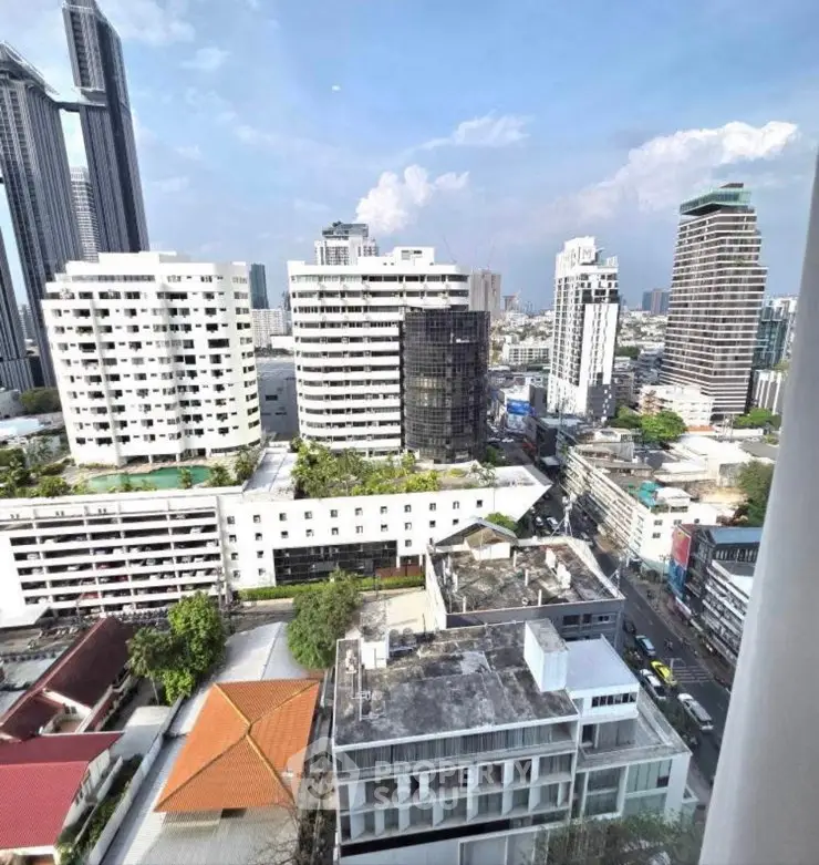 Stunning cityscape view from high-rise building in urban area, showcasing modern architecture and vibrant skyline.