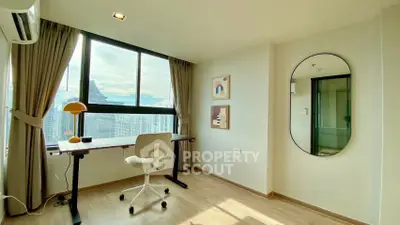 Modern study room with large window and stylish decor in high-rise apartment