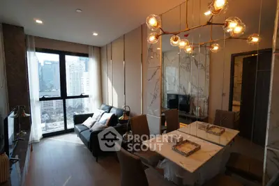 Luxurious modern living room with city view, elegant lighting, and stylish decor.