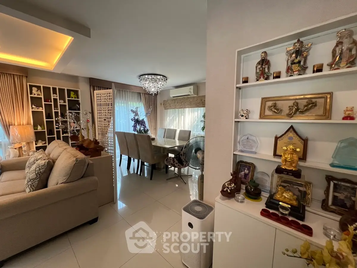 Elegant living and dining area with modern decor and ample natural light