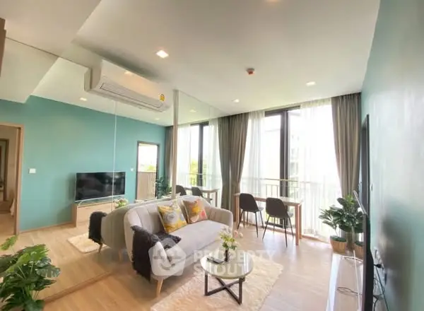 Bright and modern living room with large windows and stylish decor