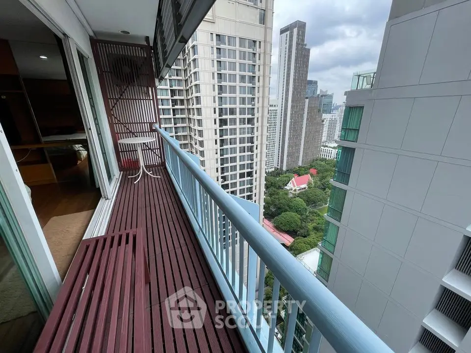 Spacious balcony with stunning city view in modern high-rise building