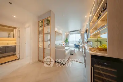 Luxurious open-plan living room with elegant decor and stunning city view.