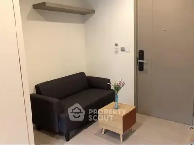 Cozy small living area with modern sofa and minimalist decor