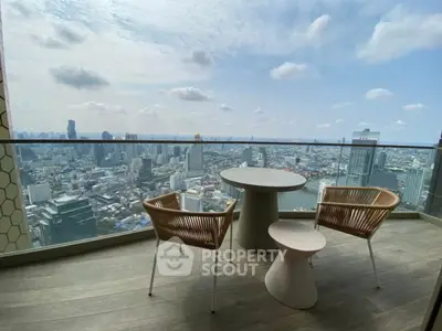 Stunning cityscape view from modern balcony with stylish seating