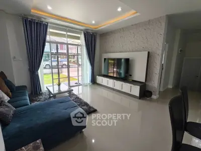 Modern living room with large TV and stylish decor