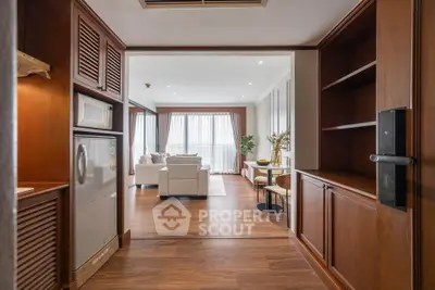 Spacious open-plan living room with elegant wooden flooring and modern furnishings
