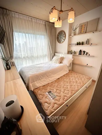 Cozy bedroom with pull-out bed and stylish decor, perfect for maximizing space and comfort.
