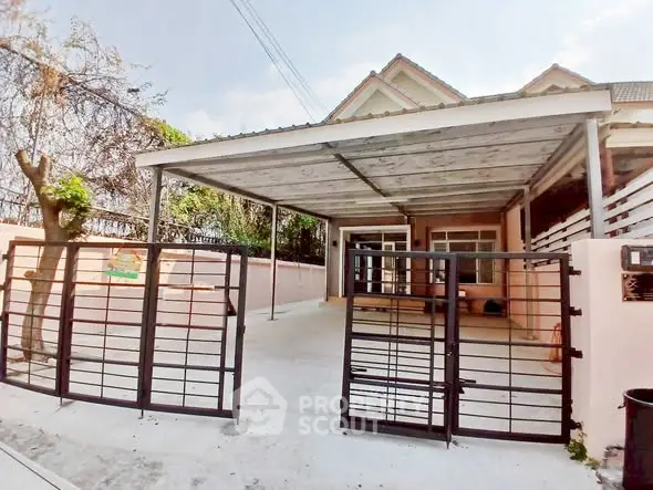 Charming single-story home with gated driveway and covered carport
