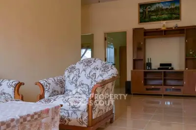 Spacious living room with elegant furniture and entertainment center