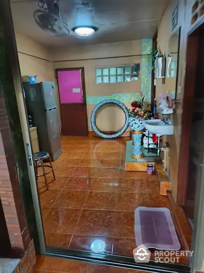 Cozy kitchen area with tiled flooring and modern appliances