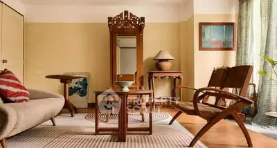Charming vintage living room with elegant wooden furniture and cozy decor.