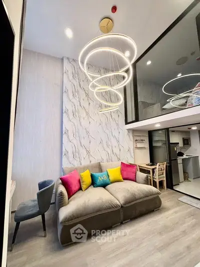 Modern living room with stylish lighting and open kitchen in a chic apartment