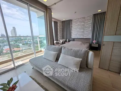 Modern living room with city view and stylish decor in a high-rise apartment