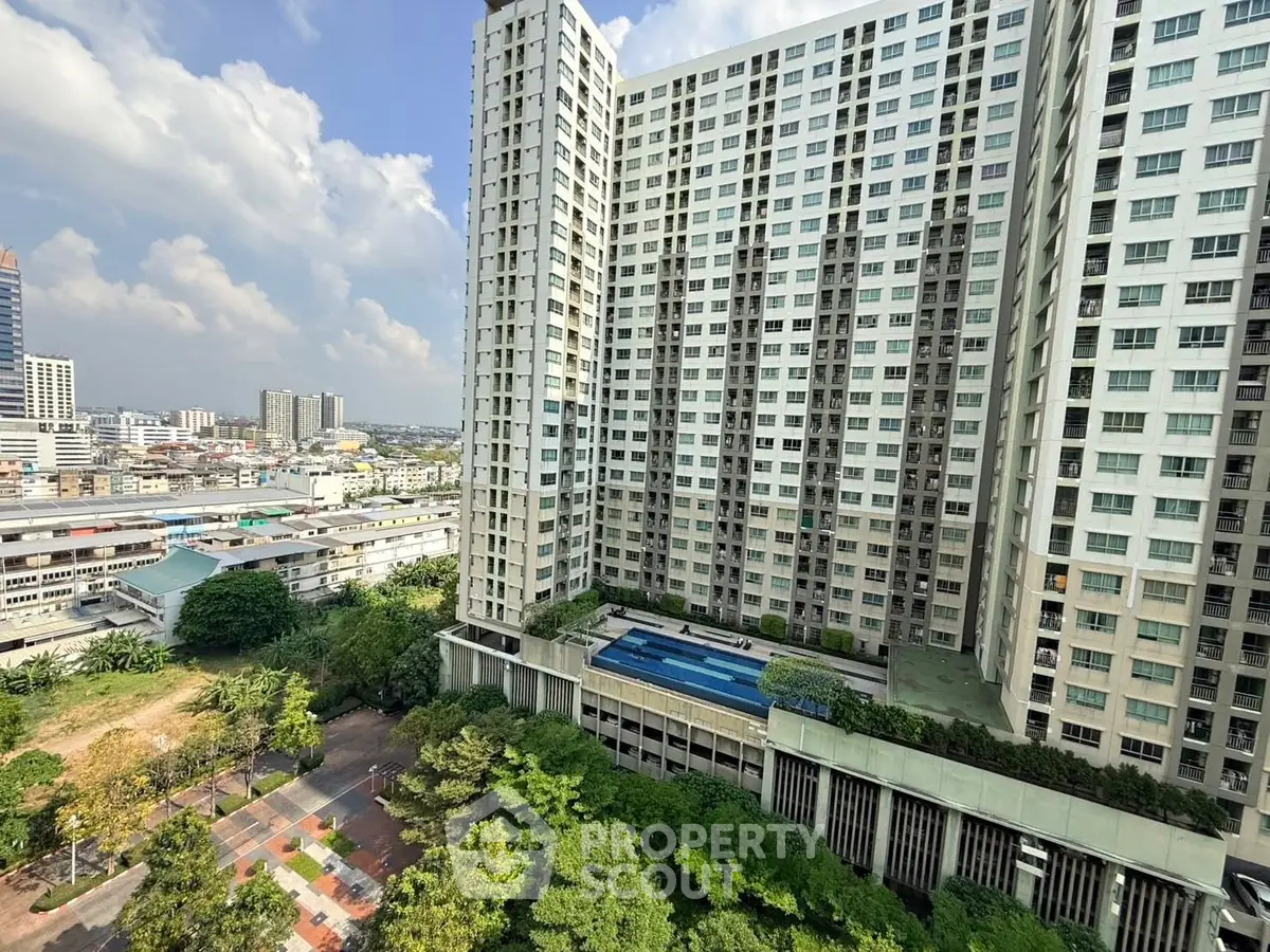 High-rise residential building with pool and cityscape view