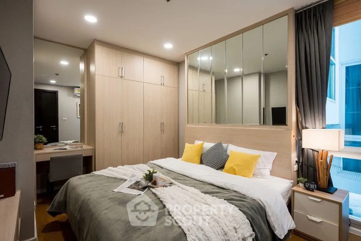 Modern bedroom with stylish decor and ample storage space
